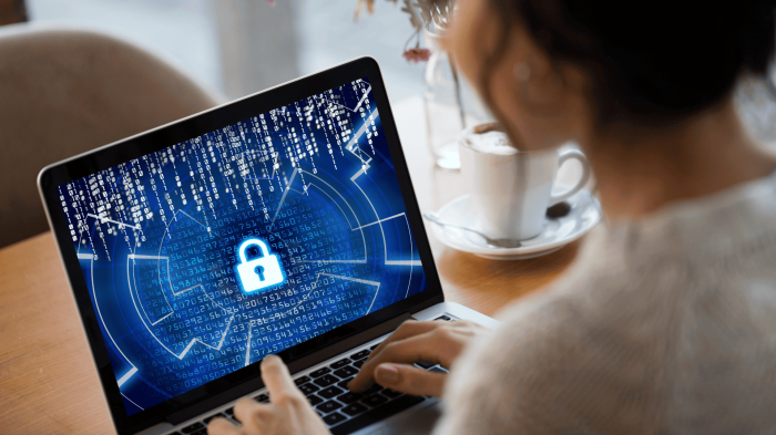 A-woman-looking-at-a-cybersecurity-icon-on-her-device